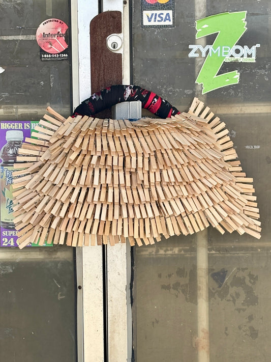 Wooden clothespin denim bag 
art on a door with visible brand logos in the background