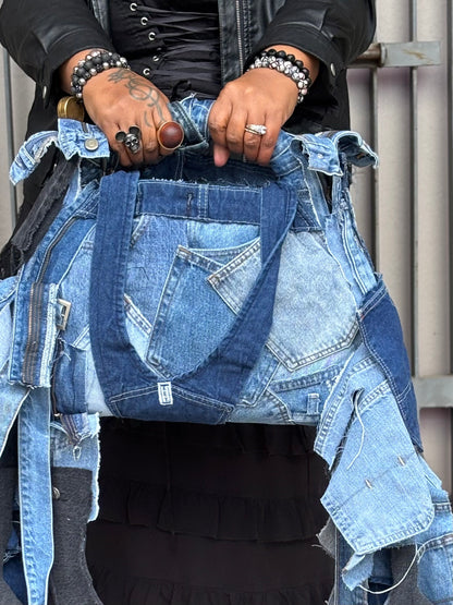 Person wearing a denim jacket with a focus on the jacket's design and details.