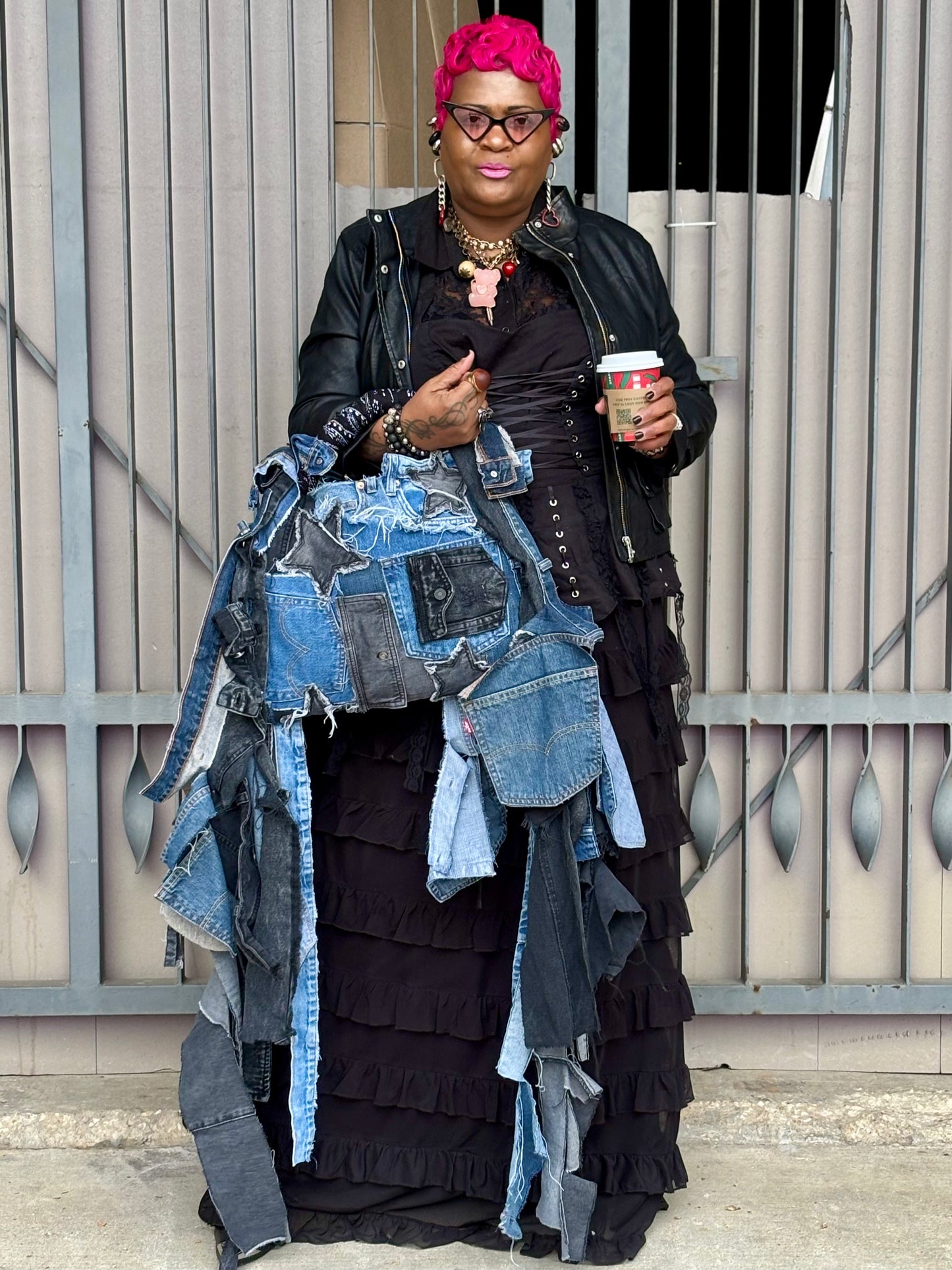 Woman holding denim bag with stars and patches , bandanna handle
