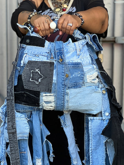 Tangie Bell showing off ugly denim bag with star patch and various textures. Funky Grunge Boutique