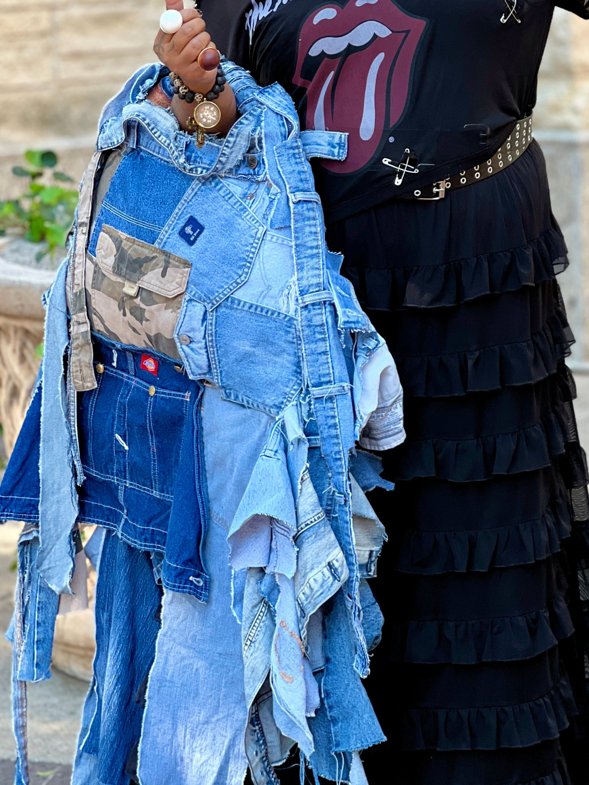 Woman showing off another ugly denim bag: Funky Grunge Boutique
