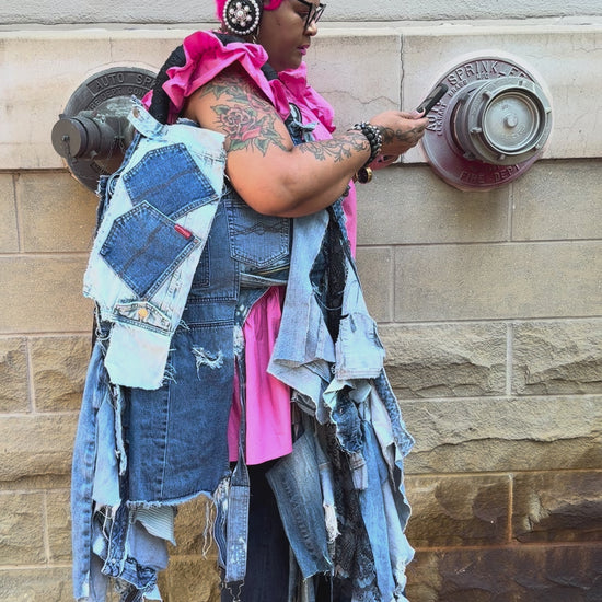 Funky Grunge Boutique Woman showing off her handmade ugly denim bag
