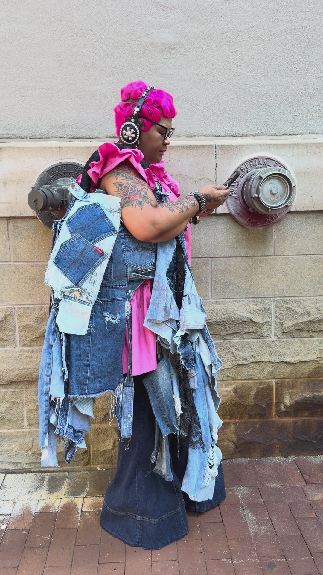 Funky Grunge Boutique Woman showing off her handmade ugly denim bag
