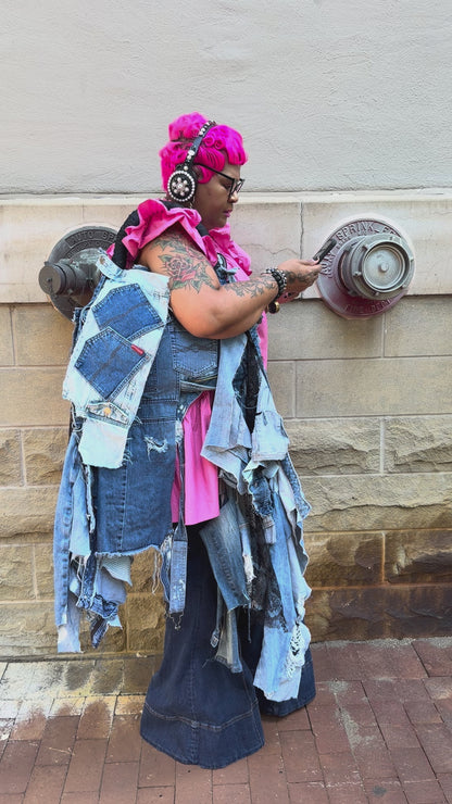 Funky Grunge Boutique Woman showing off her handmade ugly denim bag
